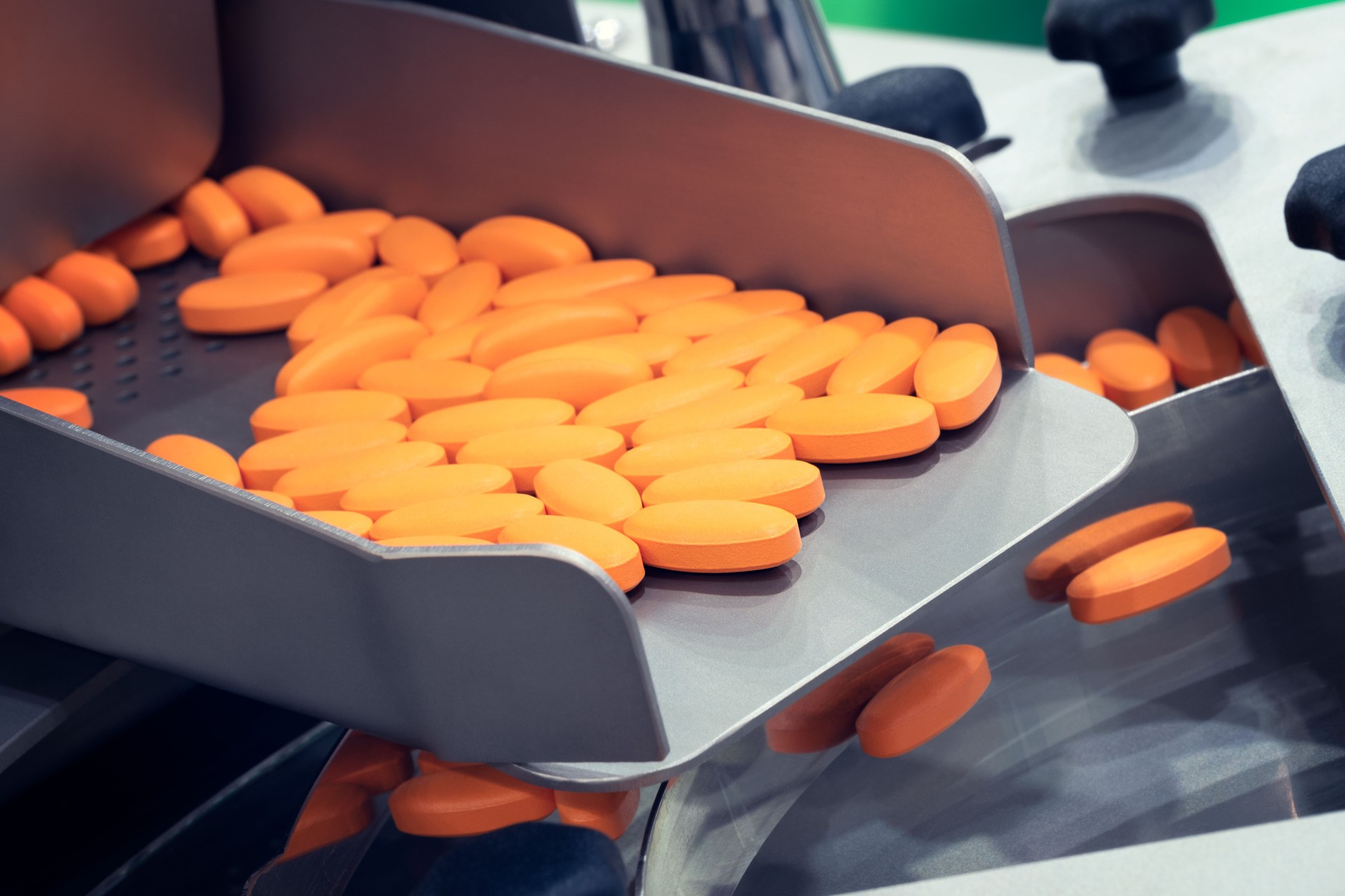 Pharmaceutical production line, production of tablets or vitamins manufacturing, tablet conveyor